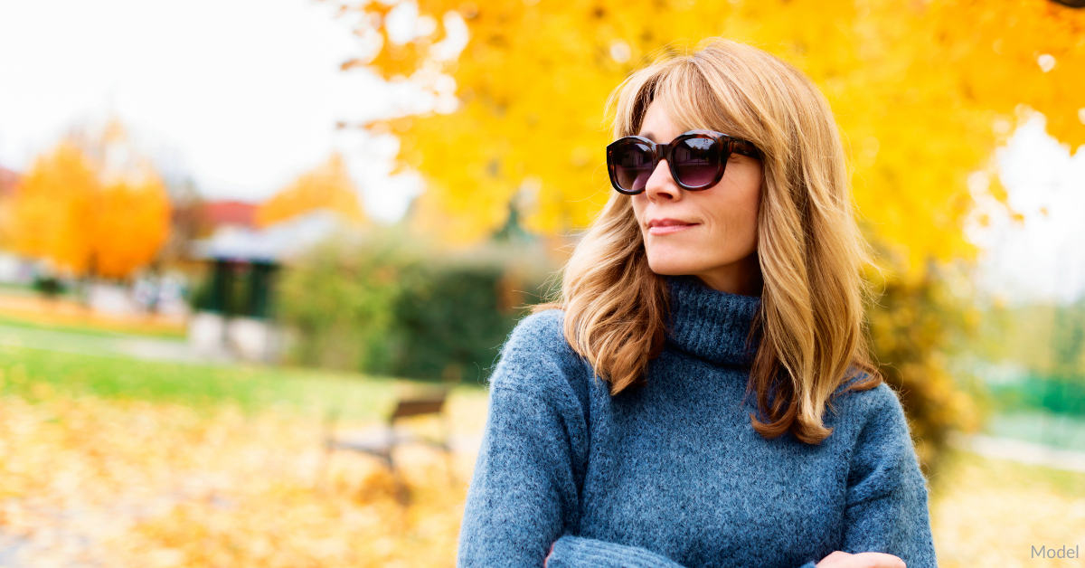 Woman outside during the fall wearing sunglasses near Omaha, NE